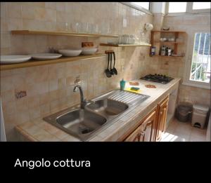 a kitchen with a sink and a counter top at Grande Procida in Procida +5 photos