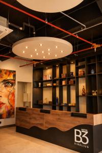 a store with a large chandelier in a room at Hotel B3 Sibelius in Chía