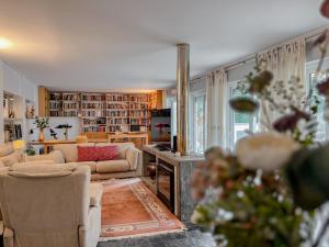 a living room with couches and a fireplace at Casa das Rampas - Nature Retreat with Pool in Moledo