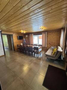 a living room with a table and a dining room at Вича in Sasivka