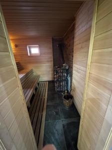 an inside view of a sauna with a bucket at Вича in Sasivka +19 photos