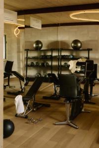a room with a bunch of chairs and a barber shop at Hidden Dalla Gioconda in Gabicce Mare