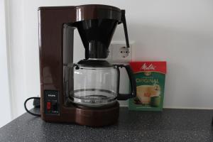 a blender sitting on a counter next to a box at Marienhof in Leibertingen