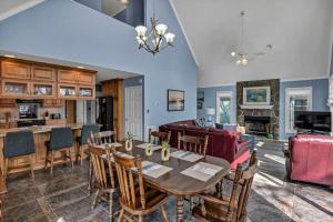 a kitchen and living room with a table and a couch at Lakefront Retreat-Sunset Views in Prosperity
