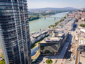 an aerial view of a city with a river and buildings at Eurovea Tower Apartment 27th floor, Luxury bed VISPRING Baronet Superb in Ovsište