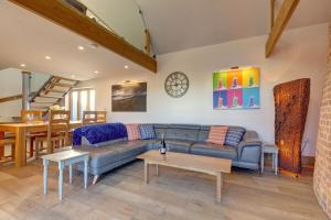 a living room with a couch and a table at Wallower in Harpley