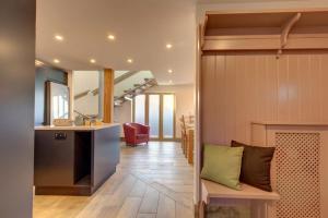 a kitchen and a living room with a couch and a table at Wallower in Harpley
