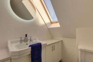 a bathroom with a sink and a mirror at Wallower in Harpley +35 photos