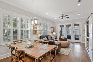 a living room with a table and a couch at Garden Cottage 62 in Jekyll Island