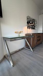 a glass table with a bird sitting on top of it at Hanza Tower Level XV Signature in Szczecin +7 photos