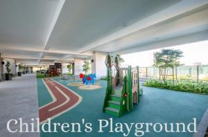 a childrens playground with a slide in a building at Skyline Luxury Suite KlCC &TRX View in Kuala Lumpur