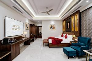 a hotel premier room with a bed and a tv at Hotel Peridot with Free Airport Pickup in New Delhi