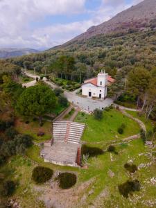 an aerial view of a small white house on a hill at La Casa Di Nonna in Licusati