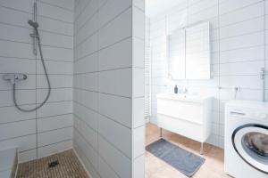 a white bathroom with a sink and a washing machine at FREYZEIT Apartment "Gässel" in der Altstadt von Speyer für bis zu 6 Personen in Speyer +11 photos