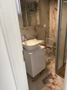 a bathroom with a sink and a mirror at Sunset Bay Casa in Dolac