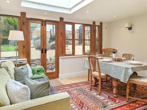 a living room with a table and a couch at 3 Bed in Trellech oc-j34206 in Trelleck