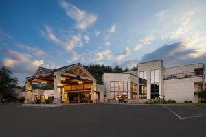 a large building with a parking lot in front of it at Holiday Inn Resort Lake George - Adirondack Area by IHG in Lake George