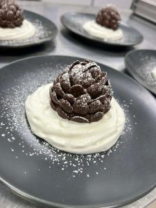a chocolate dessert on a plate on a table at Pension Savisalo in Ramsau am Dachstein +26 photos