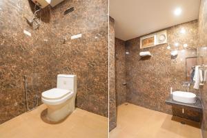 a bathroom with a toilet and a sink at Hotel Peridot with Free Airport Pickup in New Delhi +12 photos