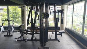 a gym with several bikes and tread machines at Apartamento Nogales in Bello