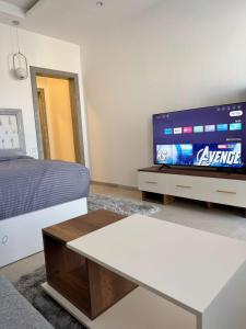 a living room with a bed and a tv at ايارو نوب-iaru nub in Dahab