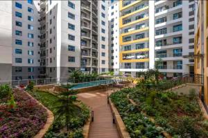 a walkway in a city with tall buildings at The Nestle & The Cradle - Kileleshwa in Nairobi