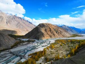 an aerial view of a river and mountains at Masherbrum House Local Cozy Home Stay in Khaplu in Khaplu +17 photos