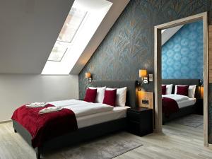 a hotel room with two beds and a mirror at B40 Green ApartRooms in Budapest