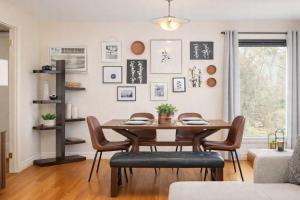 a dining room with a table and chairs at Private Riverside Retreat in Appleton +15 photos