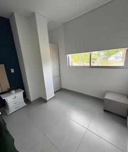 an empty room with a bed and a window at alojamientos la martina in Cali +291 photos
