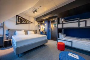 a bedroom with two bunk beds and a blue room at The Social Hub Vienna in Vienna