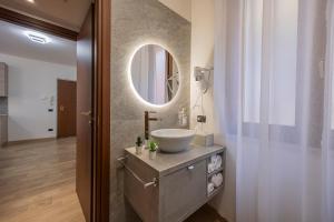 a bathroom with a sink and a mirror at PRESTIGE Apartments - Blue Serenity in Verona +17 photos