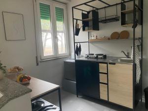 a kitchen with a sink and a counter top at Casa Diana in Tarquinia