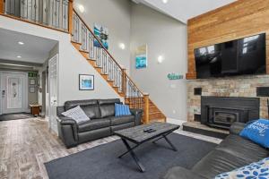 a living room with a couch and a fireplace at Executive-BBQ-Full-Kitchen-Washer-Dryer-Sauna-Backyard-Parking-Air-Conditioning in Blue Mountains