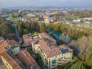 an aerial view of a building and a river at PRESTIGE Apartments - Blue Serenity in Verona