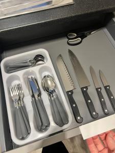 a tray of utensils in a drawer at Edinburgh Shore Apartments in Edinburgh
