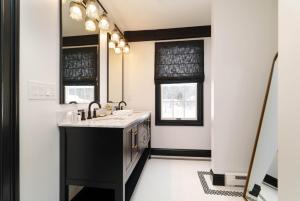 a bathroom with a sink and a mirror at Garden Gables in Lenox +108 photos