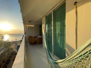 a balcony of a building with a view of the ocean at Apartamento karey 506 in Santa Marta