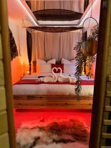 a bedroom with a bed with two swans on it at Apartmán Mair Pardubice in Pardubice