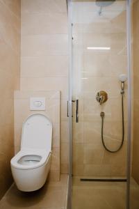 a bathroom with a toilet and a shower at Bellavista Garden in Baošići +20 photos