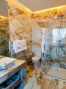 a bathroom with a shower and a toilet and a sink at Casa do Romezal in Peso da Régua +74 photos