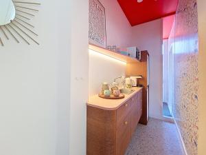 a bathroom with a sink and a counter in a room at Bed and Bert in Leuven +11 photos