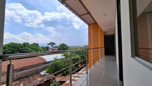 a balcony with a view of a train yard at Hospedaje Jasmine in Tarapoto