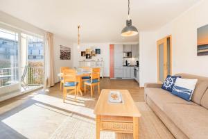 a living room with a couch and a table at Haus Strandoase 04 in Bansin