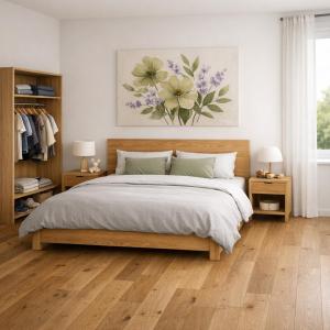 a bedroom with a large bed and two night stands at Chalet Villa Pia in Bichlbach