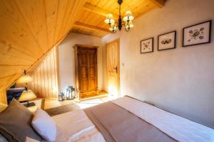Posteľ alebo postele v izbe v ubytovaní Domek Otulina