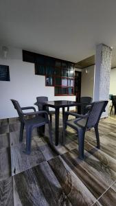 a dining room with a table and chairs in a room at Finca Casa Real la Vega in La Vega