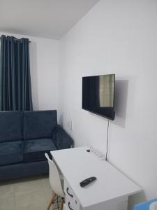 a living room with a white table and a couch at Cavendish Square Studio Unit, Syokimau in Syokimau