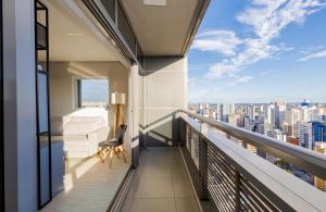 a balcony with a view of a city at Apartamento Premium - Melhor vista de Curitiba in Curitiba