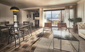 a living room with a dining room table and chairs at Terreno Suites in Palma de Mallorca